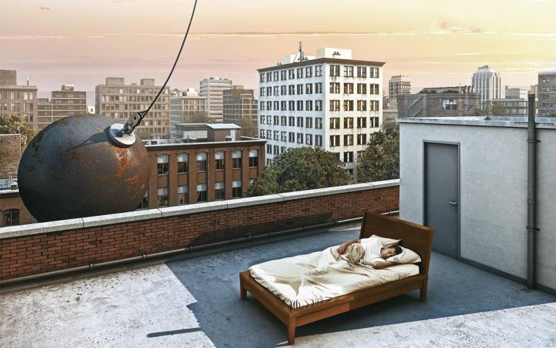 Photo montage drole humour boule demolition homme dort encore dans lit