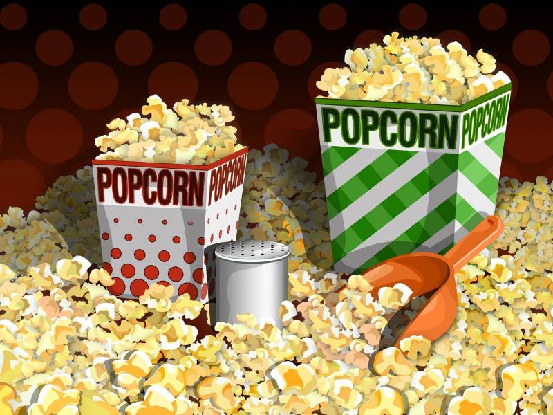 Fond ecran pop corn ambiance cinema boite popcorn dans un lit de popcorn