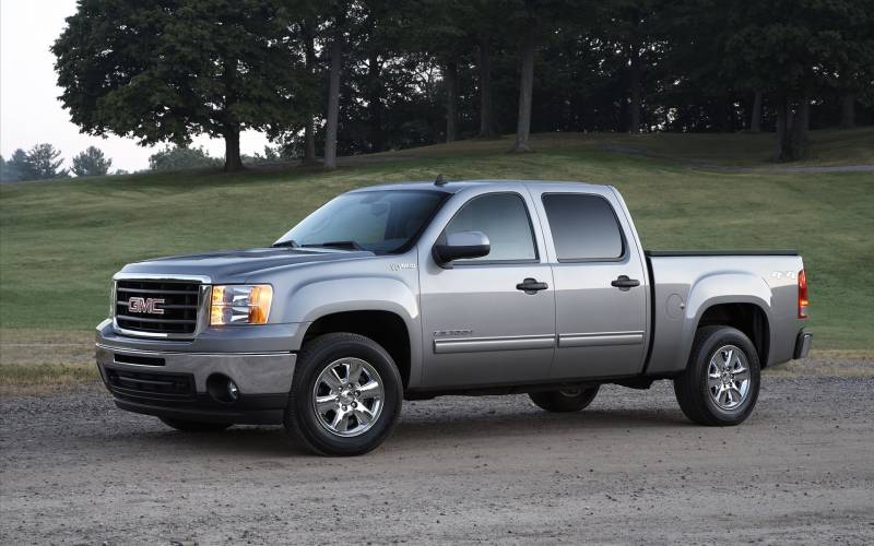 Gmc sierra hybride madness us car fond ecran pick up genral motors roule route boueuse campagne arbres hetres temps nuageux couvert